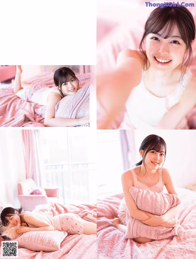 A woman laying on top of a bed holding a pillow.